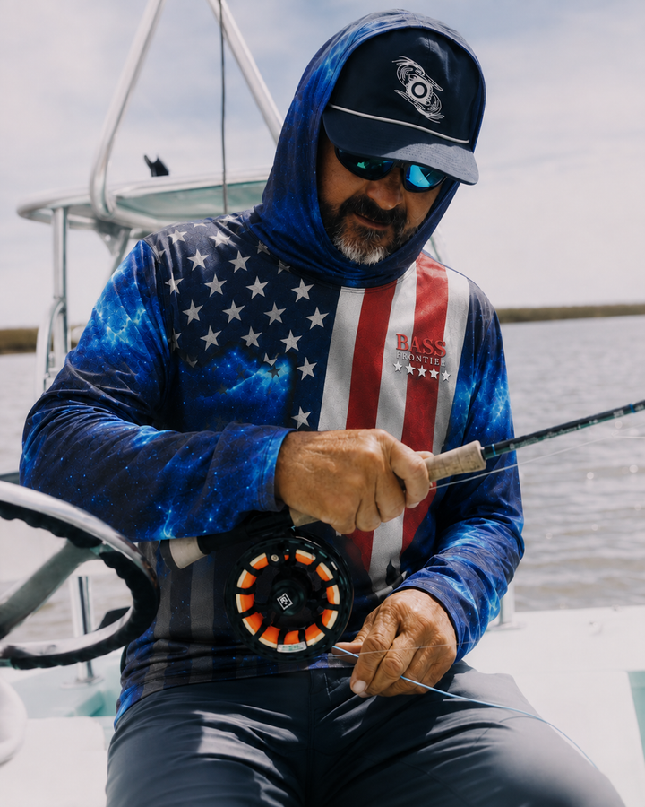 Angler rigging a rod on the boat wearing the USA Fishing Hoodie