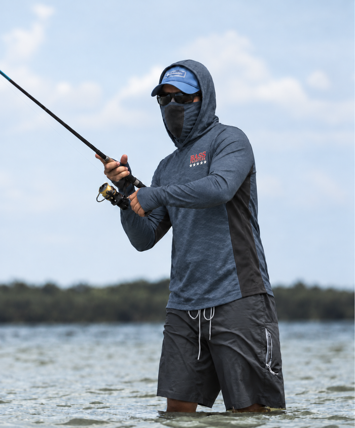 BassFrontier Slate Gray Fishing Hoodie: Angler wearing the hoodie with face covering and thumbhole cuffs